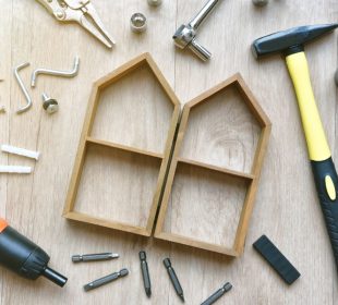 House building and maintenance, DIY and construction tools on wooden background.