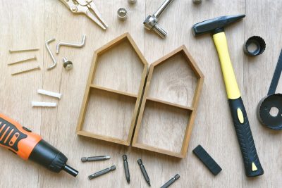 House building and maintenance, DIY and construction tools on wooden background.