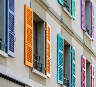 Windows with different color shutters. Geneva, Switzerland - image